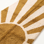 Close-up of mustard and ivory Beni Ourain rug showing soft hand-knotted wool pile and geometric ray detail