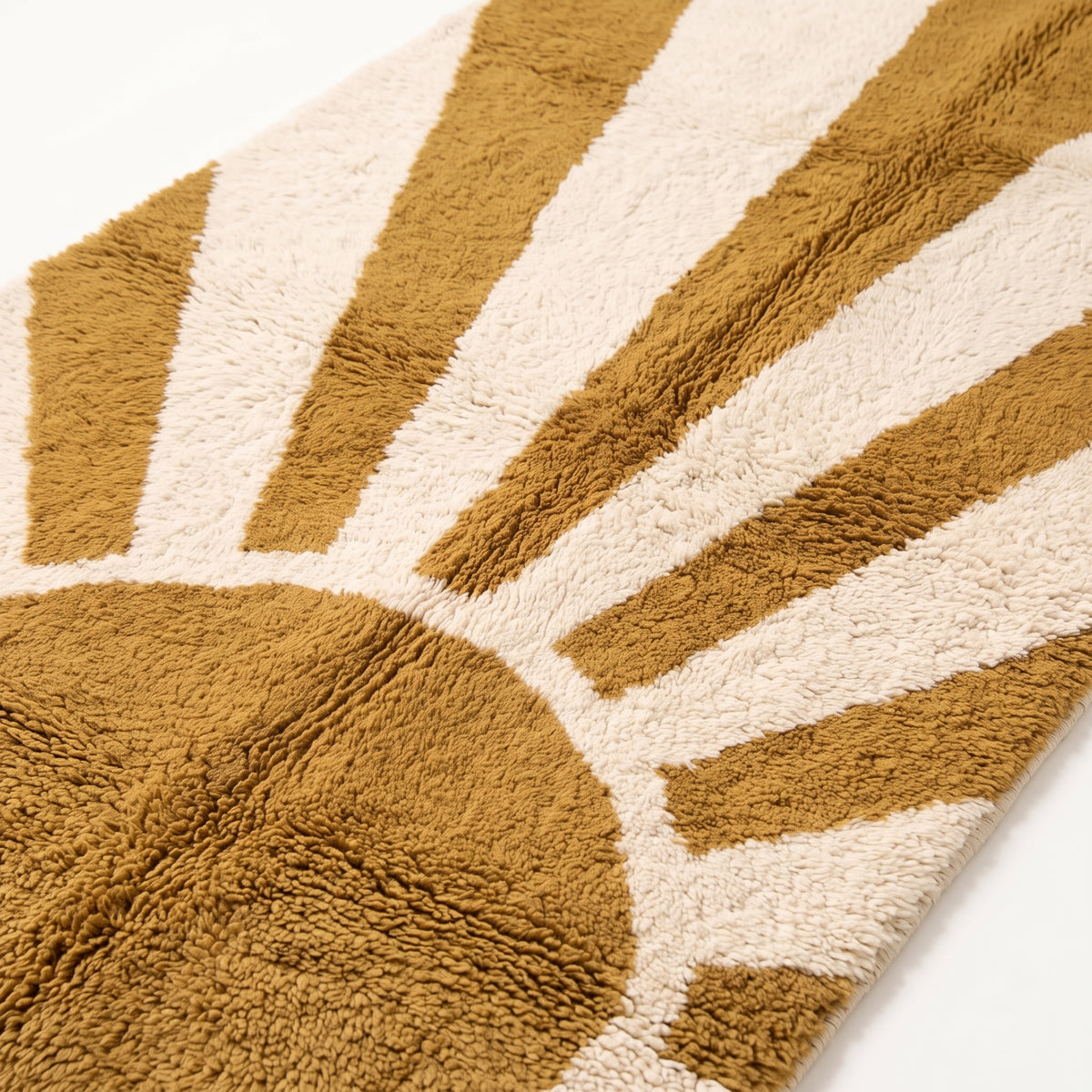 Close-up of mustard and ivory Beni Ourain rug showing soft hand-knotted wool pile and geometric ray detail