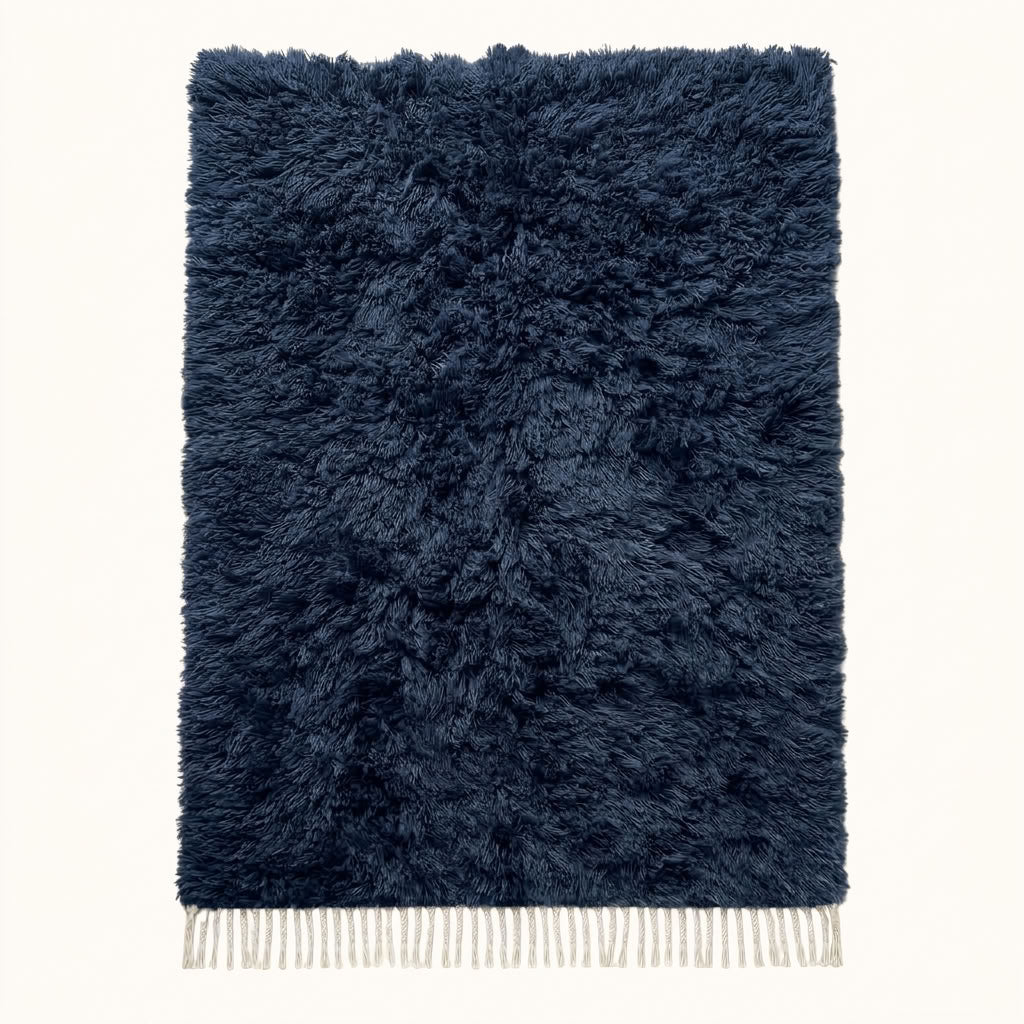 Navy Beni Ourain rug with soft textured monochromatic pile and cream fringe, full flat view