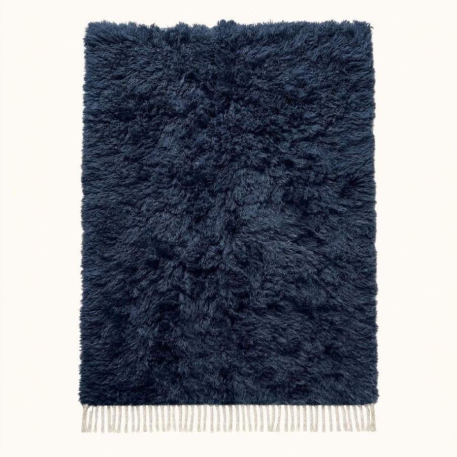 Navy Beni Ourain rug with soft textured monochromatic pile and cream fringe, full flat view