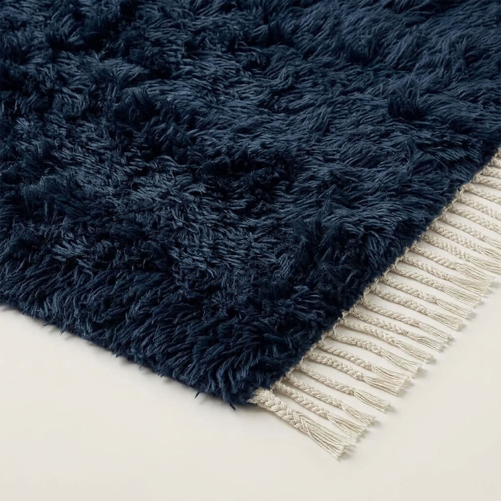 Navy Beni Ourain rug corner showing cream wool fringe and pile edge