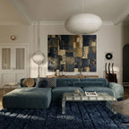 Navy Tamazirt rug styled in modern living room under blue sofa with glass coffee table