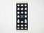 Navy and cream Mrirt runner with three columns of rounded pebbles and central geometric cross motif, flat view on plain background