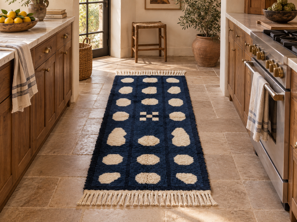 Navy and cream pebble columns runner in kitchen setting between wooden cabinets