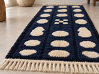Navy and cream Mrirt runner with pebble design displayed on light floor