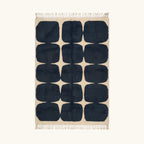 Full view of the Tamazirt navy and ivory Beni Ourain rug with a rounded grid design.