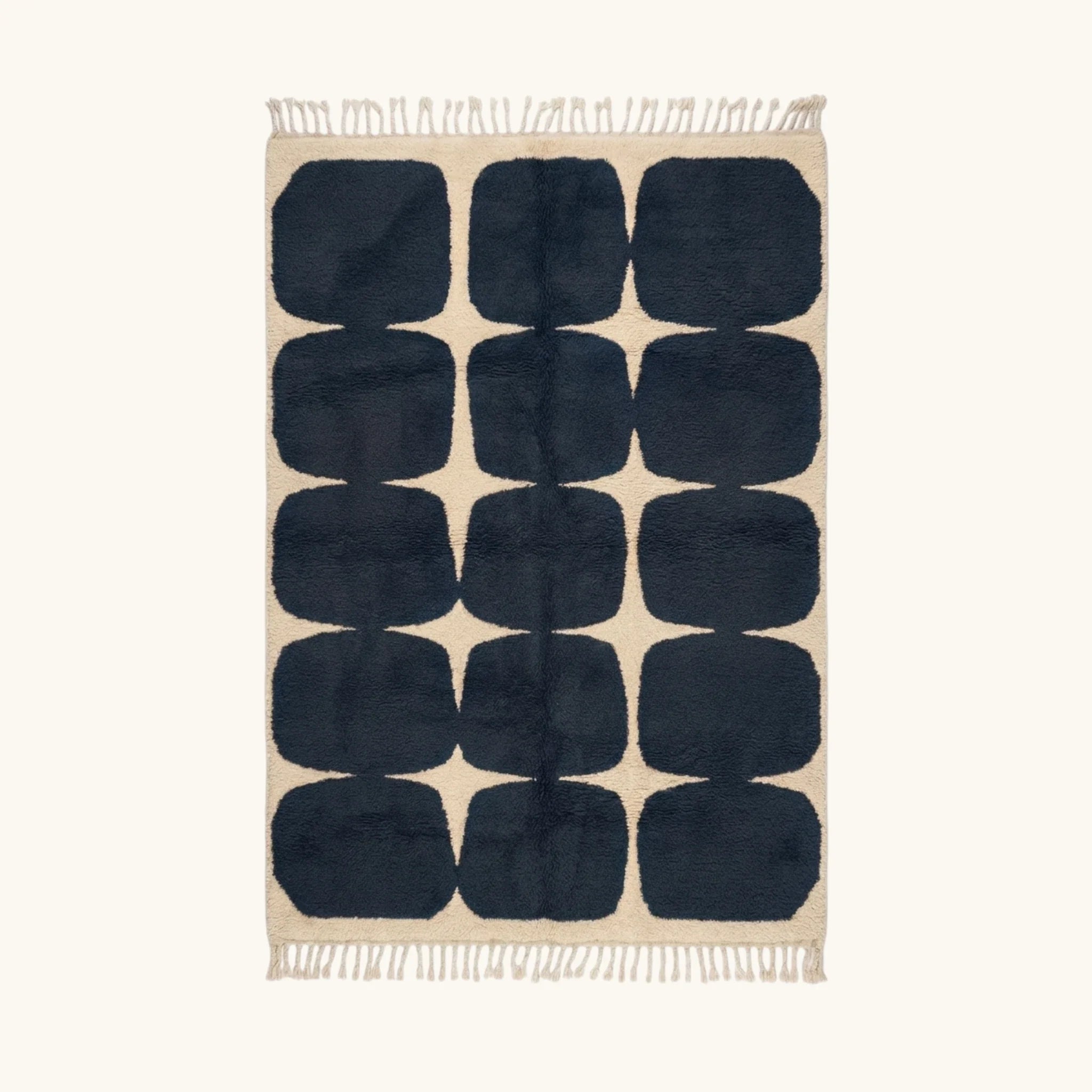 Full view of the Tamazirt navy and ivory Beni Ourain rug with a rounded grid design.