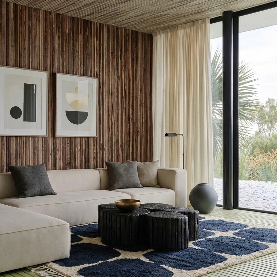 Tamazirt navy and ivory Beni Ourain rug styled in a refined living room.