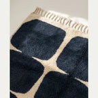 Fringe and edge detail of the Tamazirt navy and ivory hand-knotted rug.