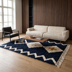 Navy and ivory Beni Ourain rug in living room with cream sofa and black chair