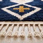 Close-up of navy and ivory diamond lattice pattern showing pile depth and texture