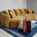 Navy Mrirt color-block rug in modern living room with mustard sofa and glass coffee table