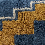 Close-up of the step climb pattern on the Adrar Moroccan wool pillow