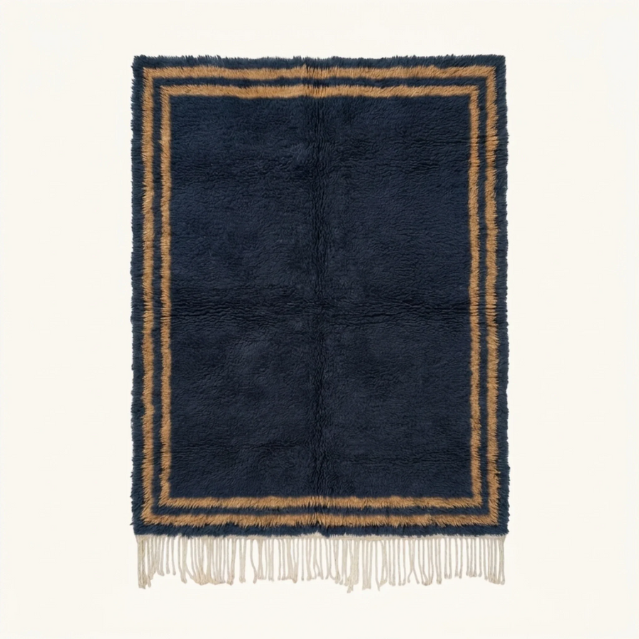 Full view of the Isli navy and ochre Beni Ourain rug with an ivory double border.