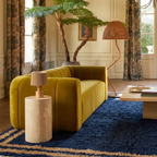 Isli navy and ochre Beni Ourain rug styled in a contemporary living room.