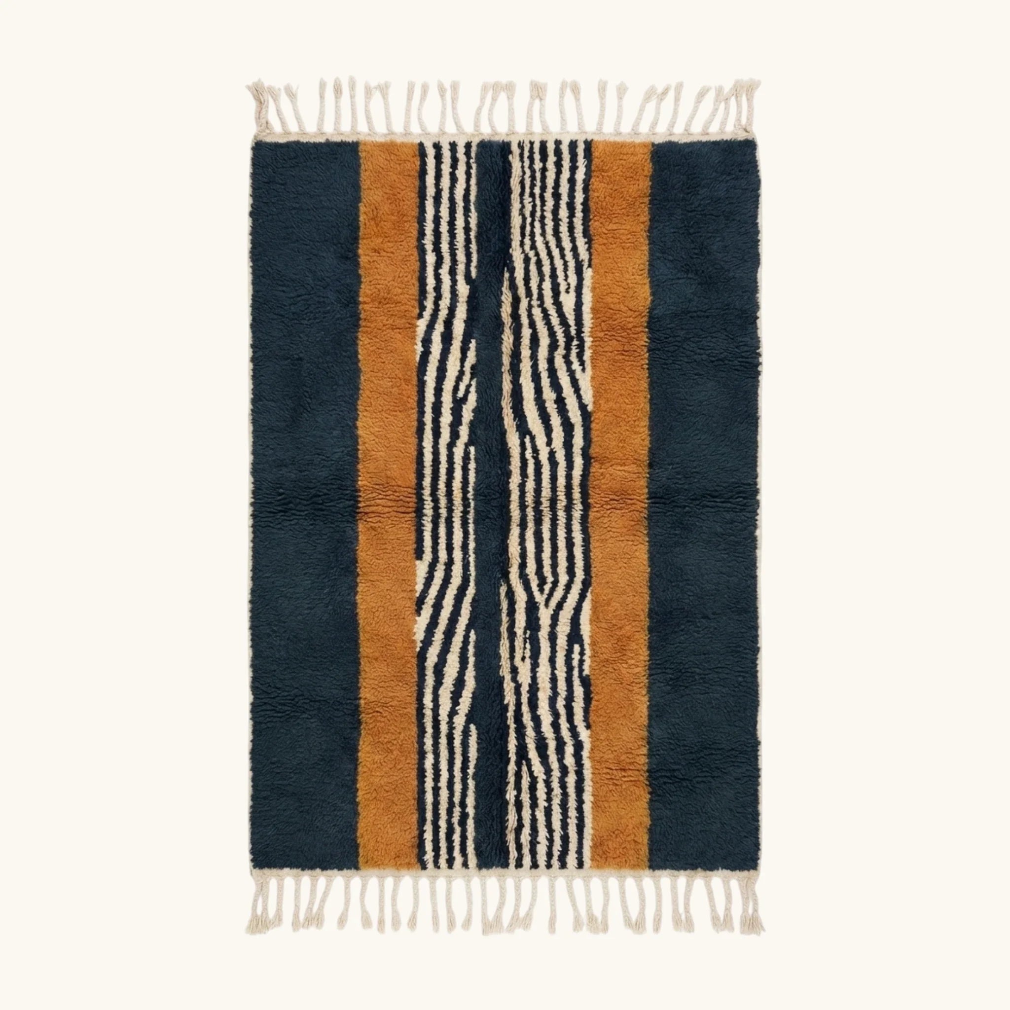 Full view of the Tifrit navy, ochre and ivory Beni Ourain rug with a central stripe design.