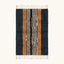Full view of the Tifrit navy, ochre and ivory Beni Ourain rug with a central stripe design.
