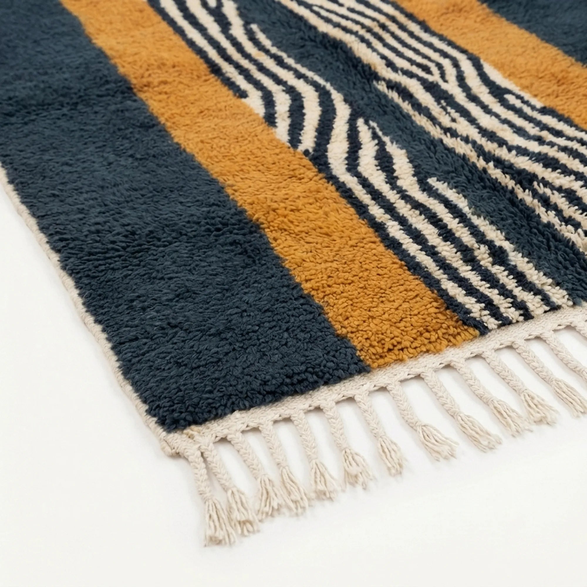 Close-up of the natural Atlas wool texture on the Tifrit rug.