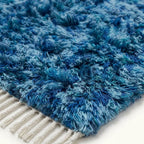 Detail of ivory fringed edge and navy textured pile on Beni Ourain rug Itri