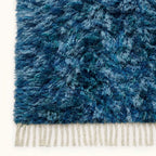 High-angle close-up of navy, pale blue and ivory hand-knotted wool texture on Beni Ourain rug Itri