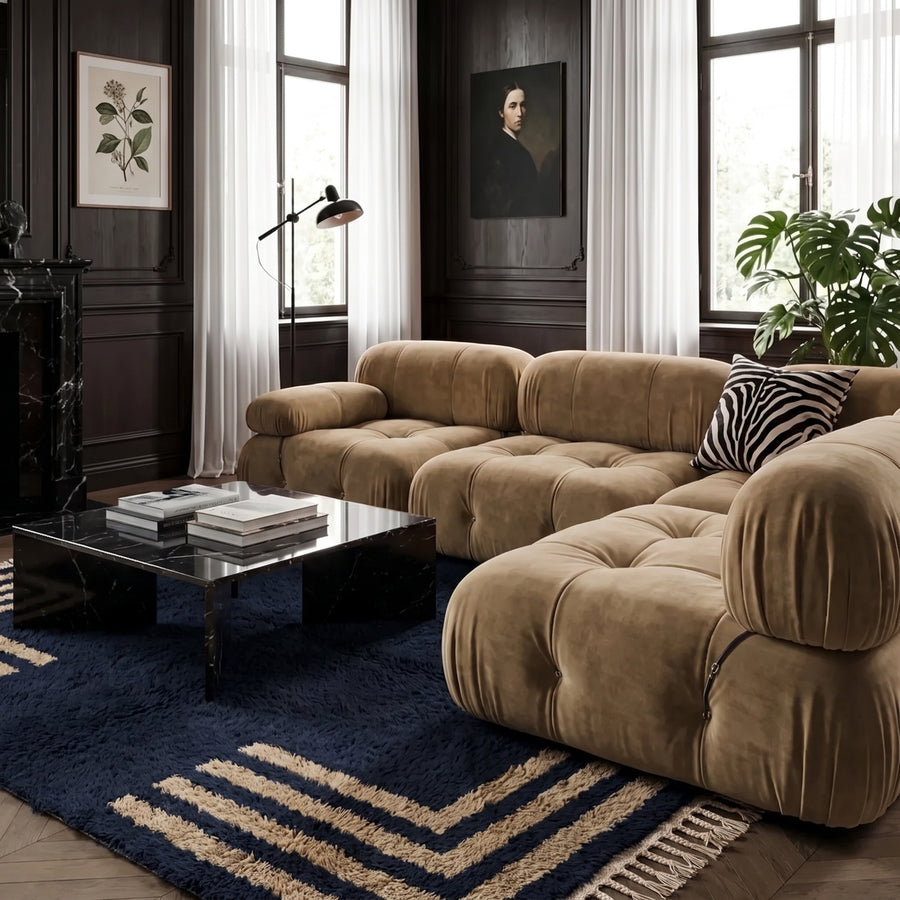 Navy and tan Beni Ourain corner frame rug in modern living room with tan sofa