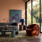 Olive and fawn Mrirt rug in modern living room with terra cotta walls and contemporary furniture