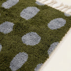 Close-up of the slate blue oval grid pattern on the Azil olive green Beni Ourain rug.