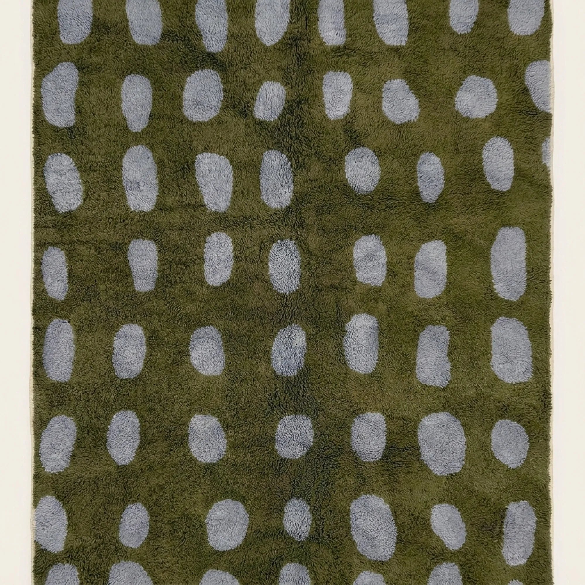 Hand-finished artisan detail of the Azil olive green and slate blue Beni Ourain rug.