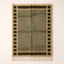 Olive and ivory Mrirt rug with checkered border frame design on plain background