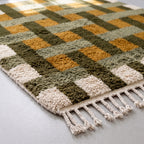 Corner detail of Zarwa rug showing fringe and dense knotted construction