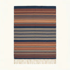 Navy Zanafi Kilim rug Ounila with layered rust and ivory stripes, full rug view