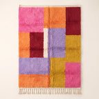 Zayna Azilal rug, full view on plain background, pink, orange, burgundy, lavender, mustard and cream colour blocks in asymmetric grid