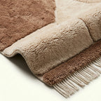 Ivory & Taupe Mrirt rug Imzran, abstract stone forms edge detail