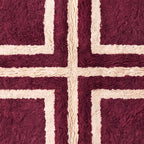 Close-up of plum Beni Ourain rug fringe and cross motif detail showing knot work and construction