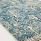 Powder blue and ivory Mrirt rug Tisslit edge and texture detail
