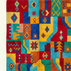 Close-up of the geometric star and diamond patchwork on the Tazdayt Boujaad rug.