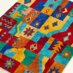 Detail view of the Tazdayt Boujaad rug showing its colorful handwoven pattern.