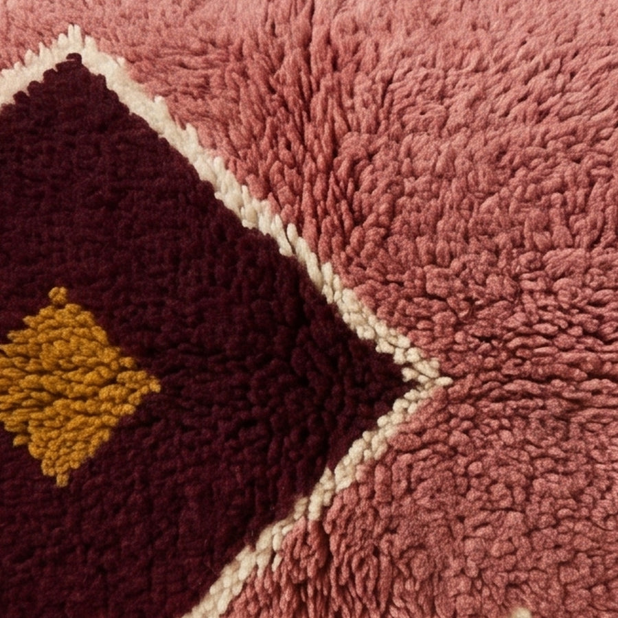 Close-up of the rose medallion pattern on the Lalla Moroccan wool pillow