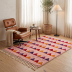 Rose Boujaad sawtooth rug in modern living room setting beside leather chair and side table