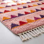 Angled pile detail of Boujaad rug showing sawtooth triangle rows with vibrant colour contrast