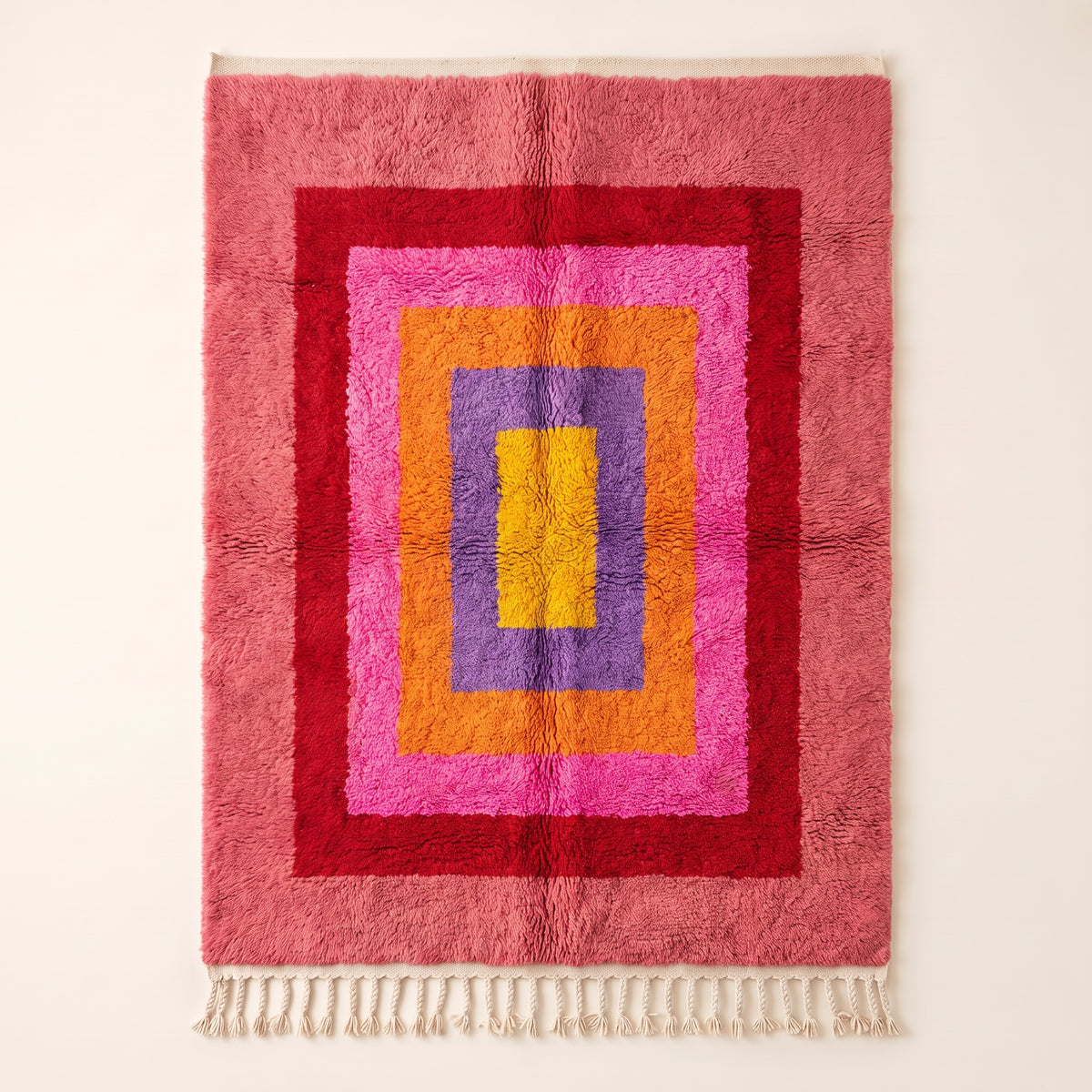 Rose pink, magenta, gold and purple Azilal rug with nested rectangle design, full flat view showing concentric frames around central yellow rectangle