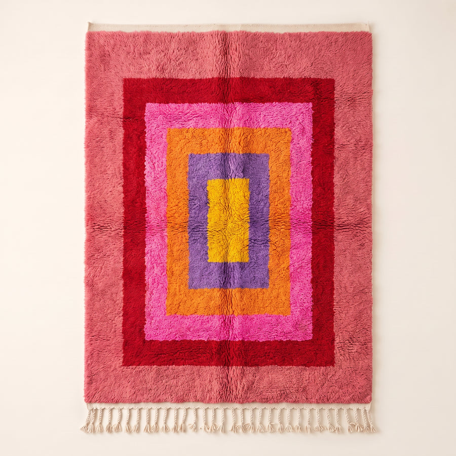 Rose pink, magenta, gold and purple Azilal rug with nested rectangle design, full flat view showing concentric frames around central yellow rectangle