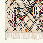 Craftsmanship and motif detail of the ivory Amud Azilal rug