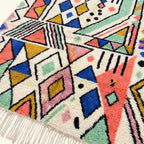 Craftsmanship and border detail of the ivory coral Tayri Azilal rug