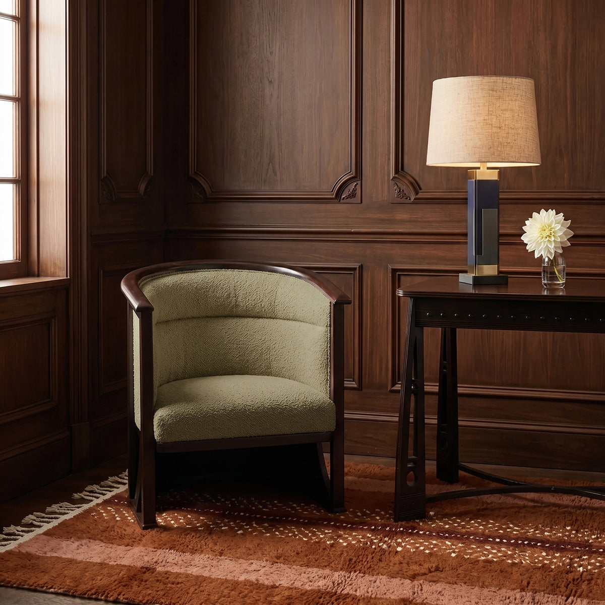 Rust and fawn Beni Ourain rug in elegant wood-panelled room with cream armchair and side table