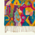 Fringe and edge detail of the Asirem saffron Boujaad rug.