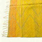 Saffron Yellow Zanafi kilim rug Agdz with gray chevrons, fringe detail