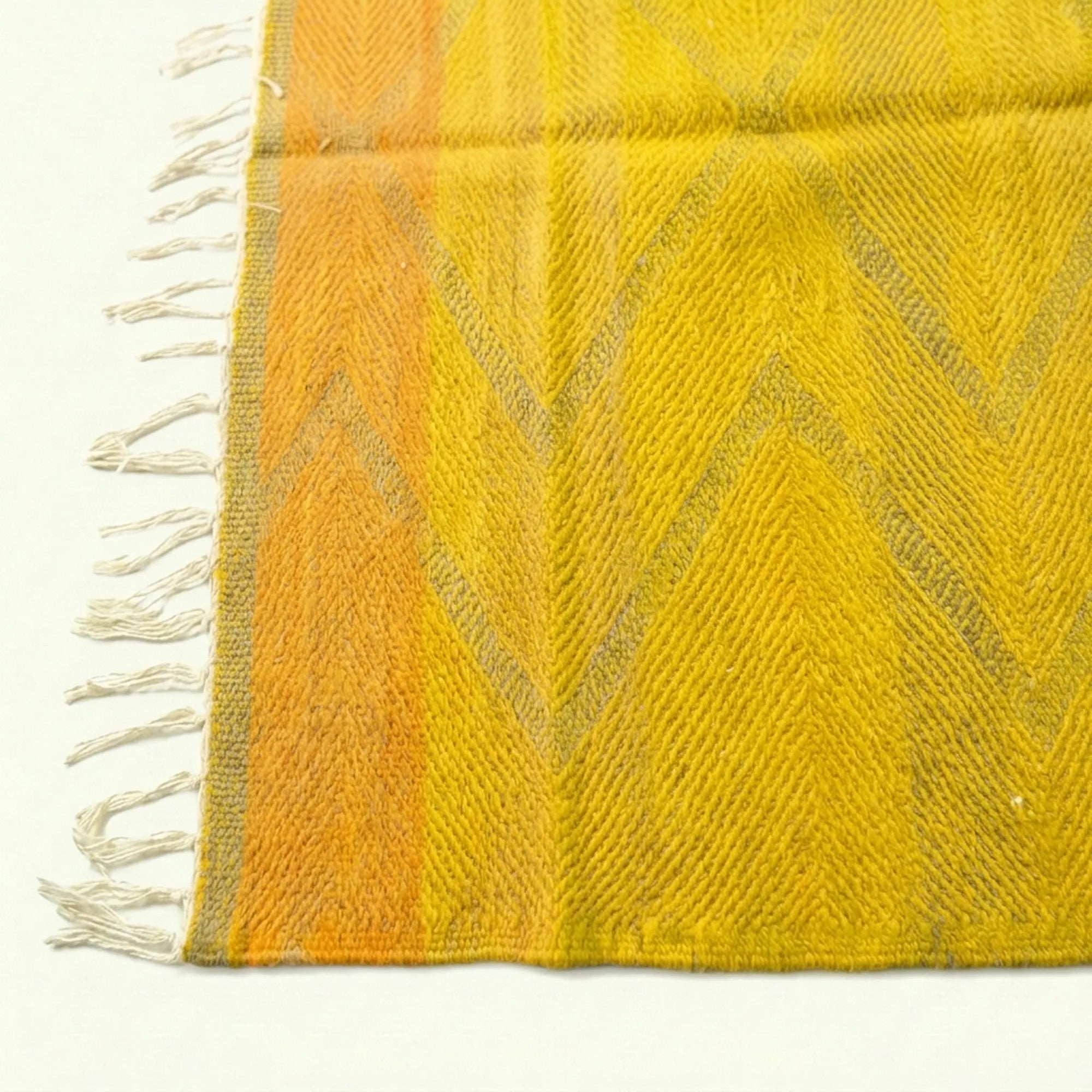 Saffron Yellow Zanafi kilim rug Agdz with gray chevrons, fringe detail