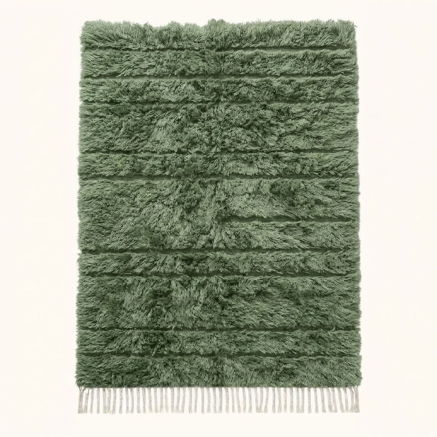 Sage green Beni Ourain rug with cream horizontal bands and thick wool pile, flat lay on white background