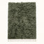 Sage green and ivory Beni Ourain rug Talwit with undyed shag texture, flat lay on plain background